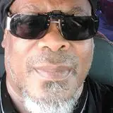 a man wearing sunglasses and a hat